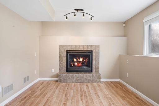 Cozy up next to the gas fireplace in the lower level family room.