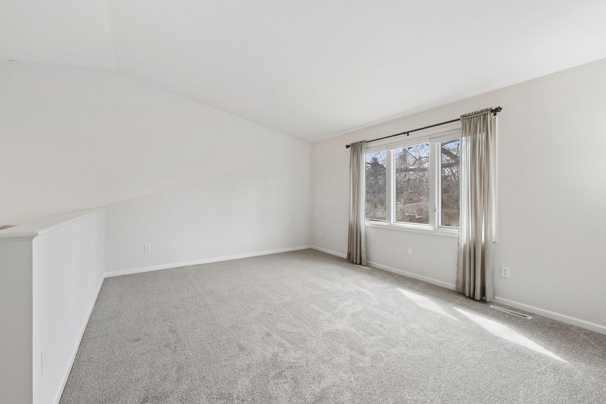 Large, bright family room with vaulted ceilings