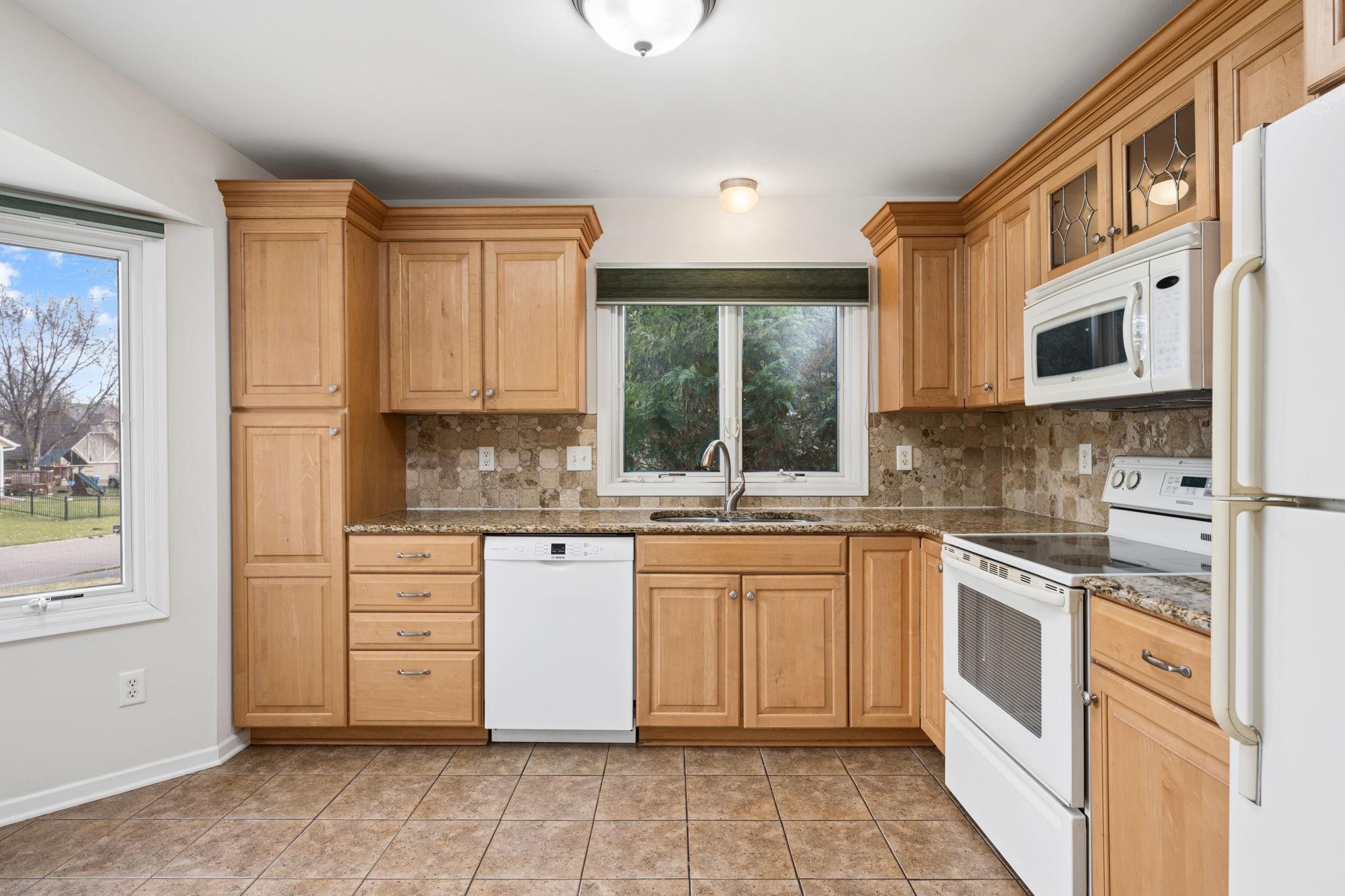 Good size kitchen with plenty of cabinet and counter space.