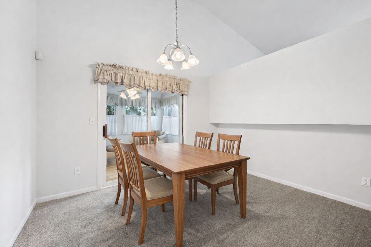 Spacious dining area with room for a large dining table for gatherings! (virtually staged)