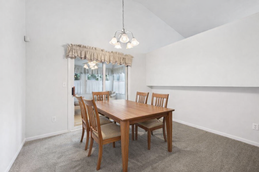 Spacious dining area with room for a large dining table for gatherings! (virtually staged)