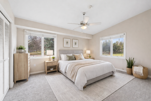 Retreat to your peaceful, sunlit primary bedroom (virtually staged).