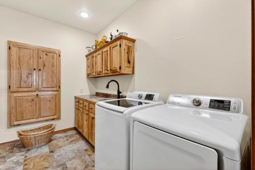 Custom pass thru laundry shoot to master bed closet above basket.