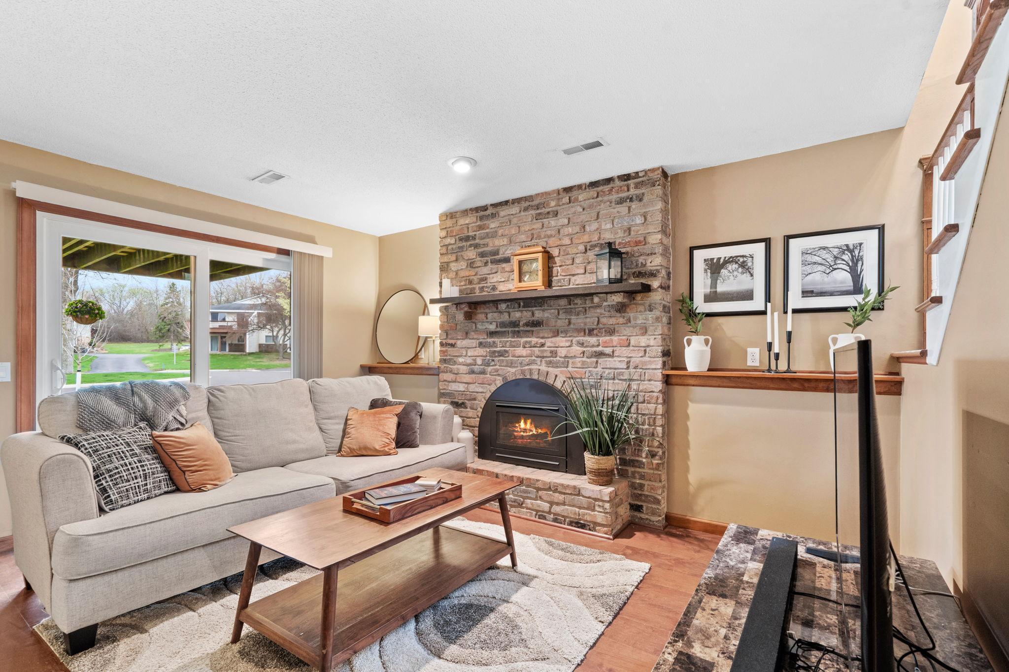 Lower living area with gas fireplace and new sliders in walkout