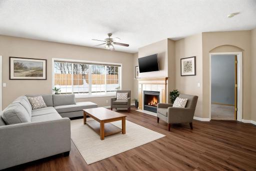 Huge and light-filled living room with cozy gas fireplace