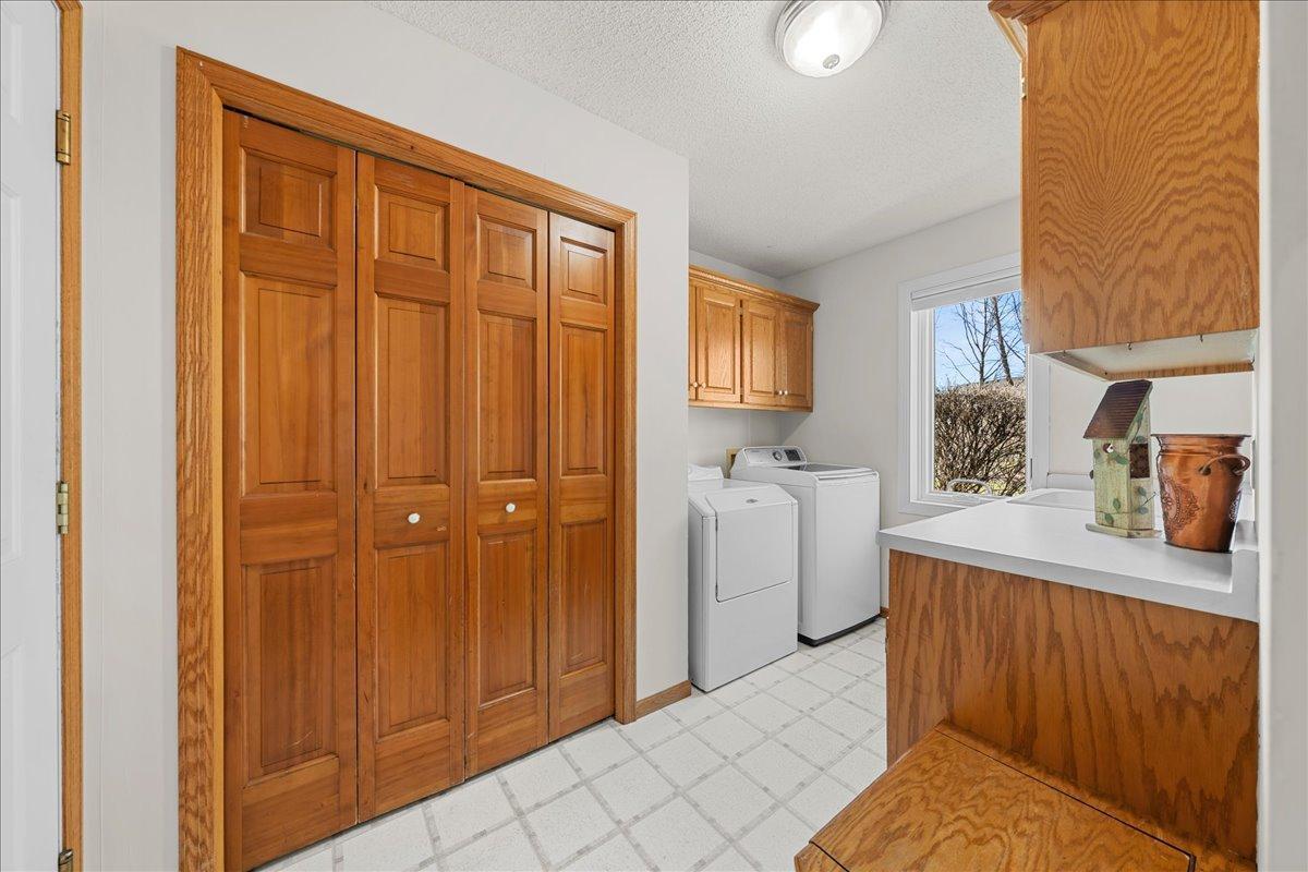 Main level laundry with closet.