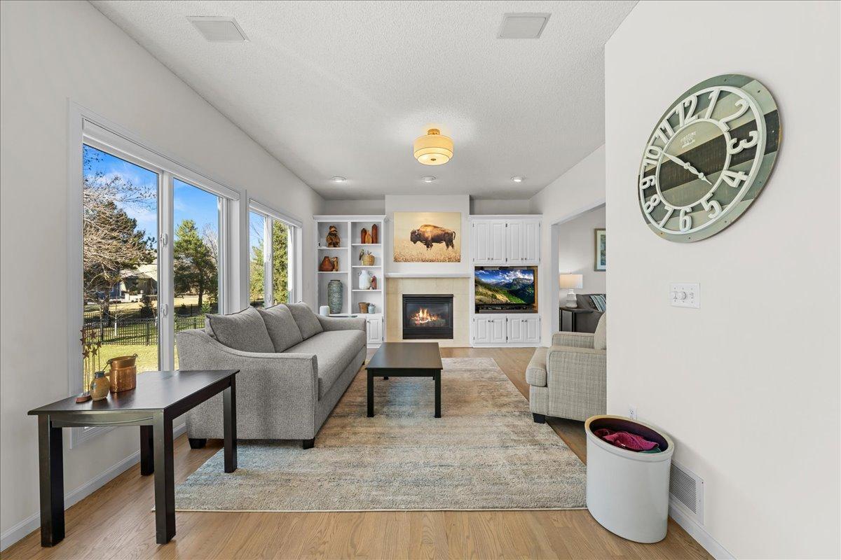 Family room with gas fireplace and custom built-ins.
