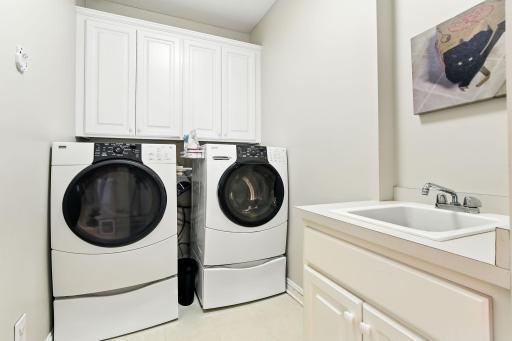 Main level laundry with adjacent sink