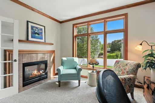 Main level office with gas fireplace and french doors