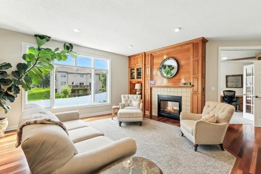 Spacious living room with large windows and gas fireplace