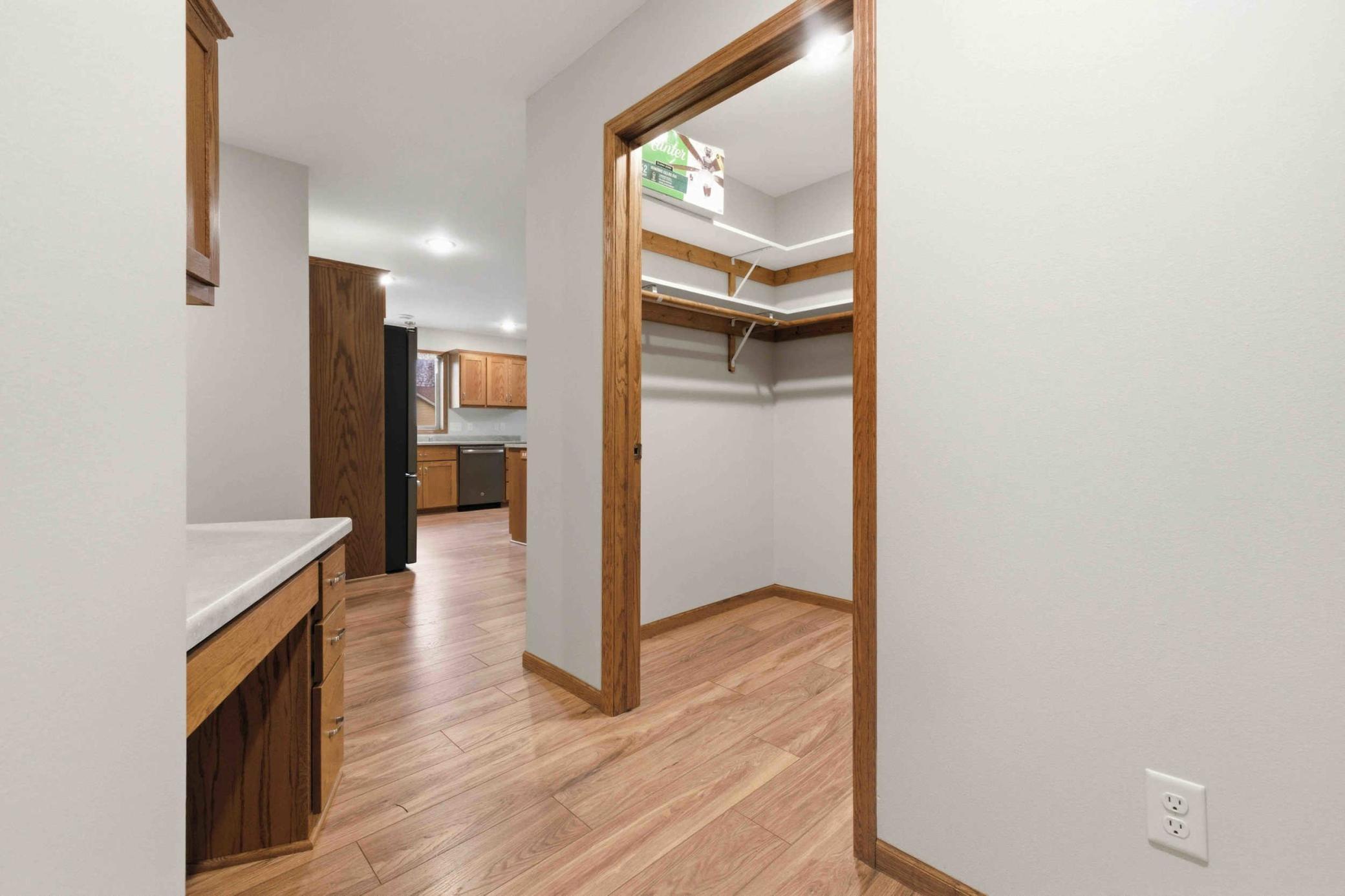 Walk in closet by garage entryway