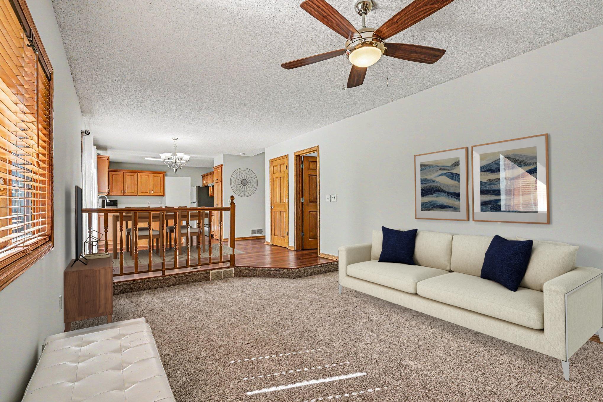 Virtually staged family room and kitchen