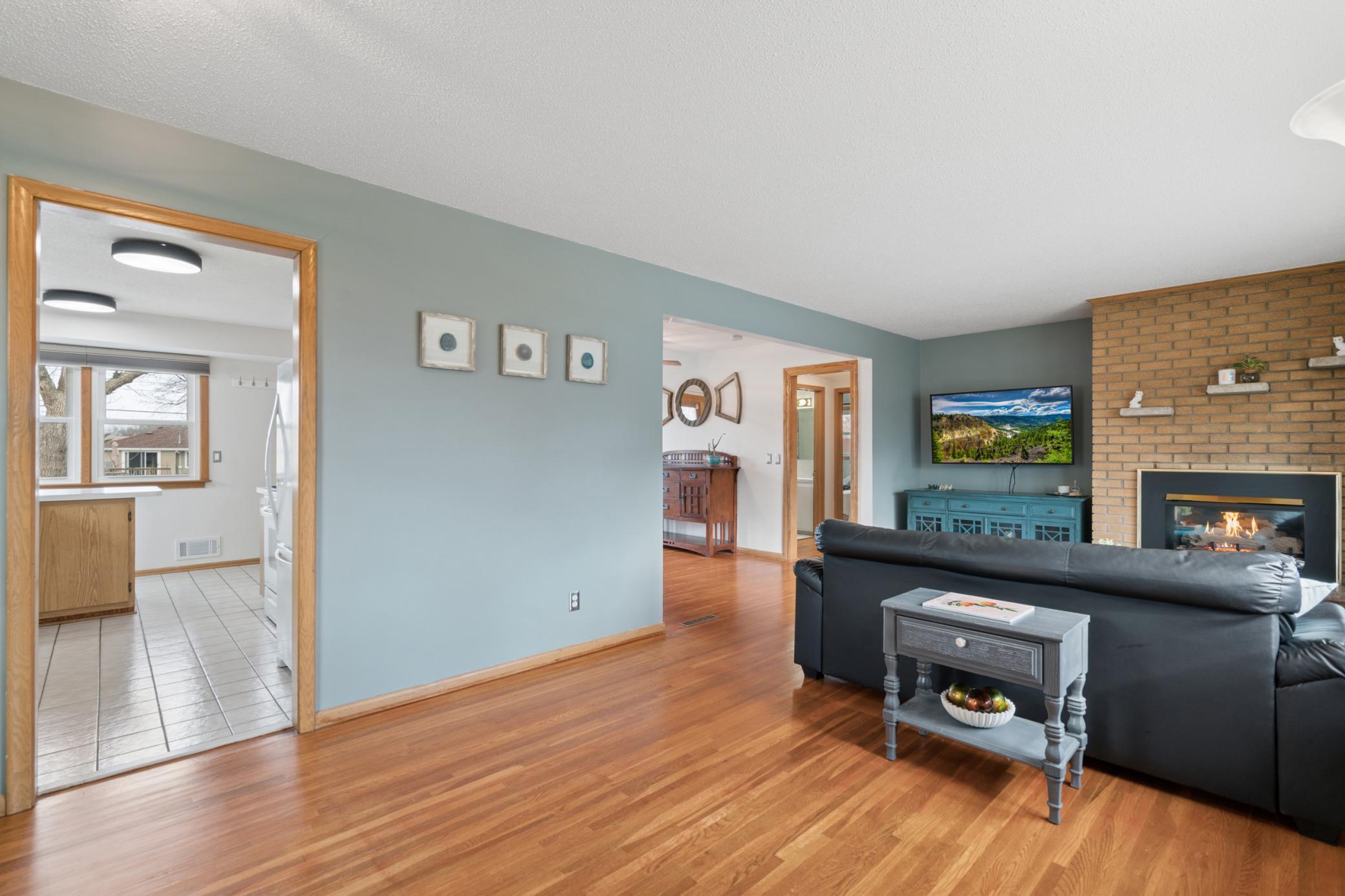 Welcoming front entry with a natural connection to the living room, kitchen, and dining area