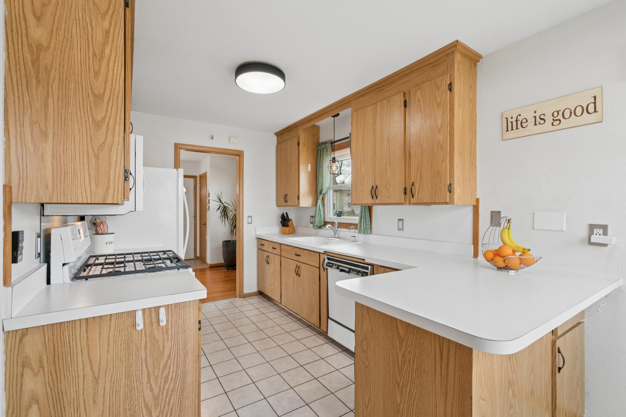 Bright, functional kitchen with access to both dining and outdoor spaces