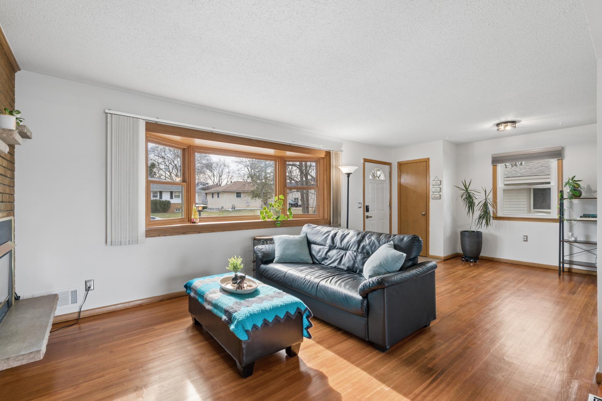 Fresh paint and refinished hardwood floors create a clean, cohesive main level