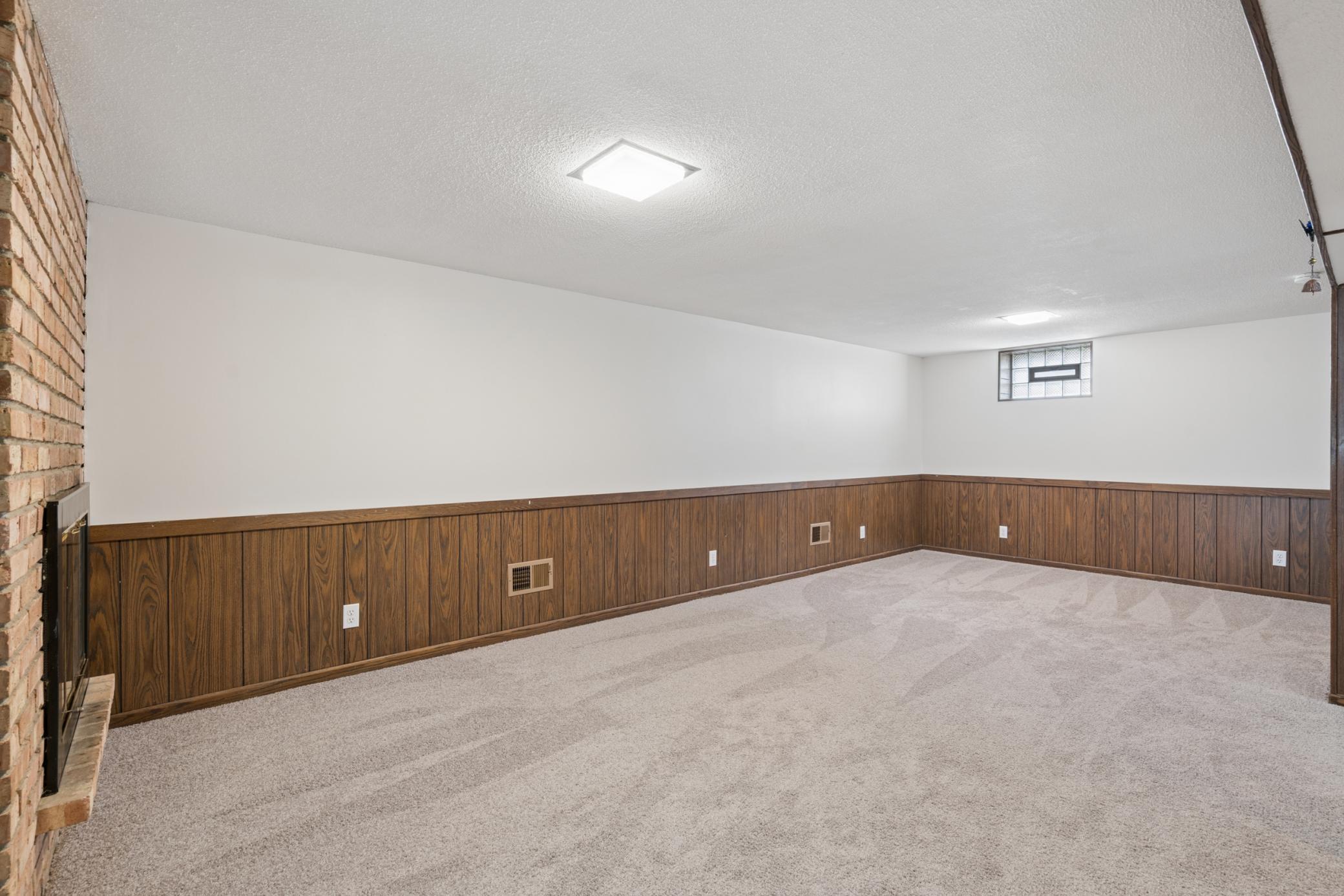 Generous lower level with space for entertaining or future customization