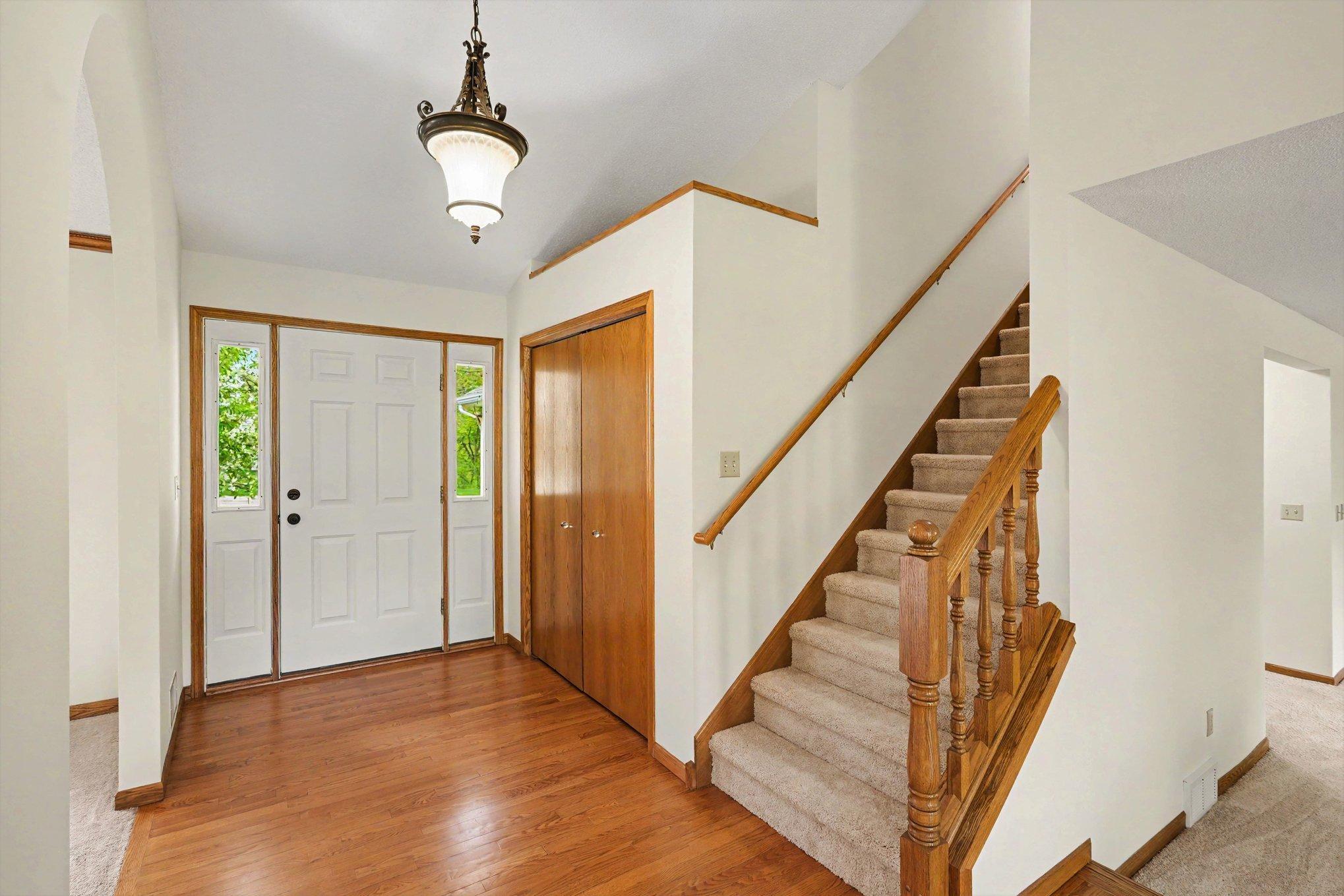The bright, open foyer greets you with hardwood floors, sidelights, and a spacious coat closet. Freshly painted throughout, this home feels crisp, clean, and completely move-in ready. High-style convenience from the moment you step inside!