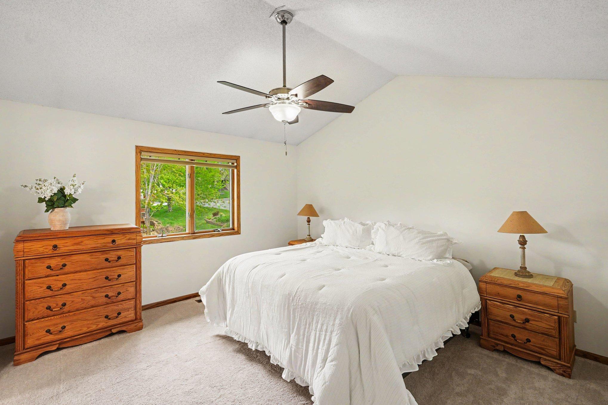 The upper level features three bedrooms with brand new carpet, including a spacious primary suite. With vaulted ceilings, a ceiling fan, a private full bath, and a walk-in closet with a built-in organization system, it’s a true retreat!