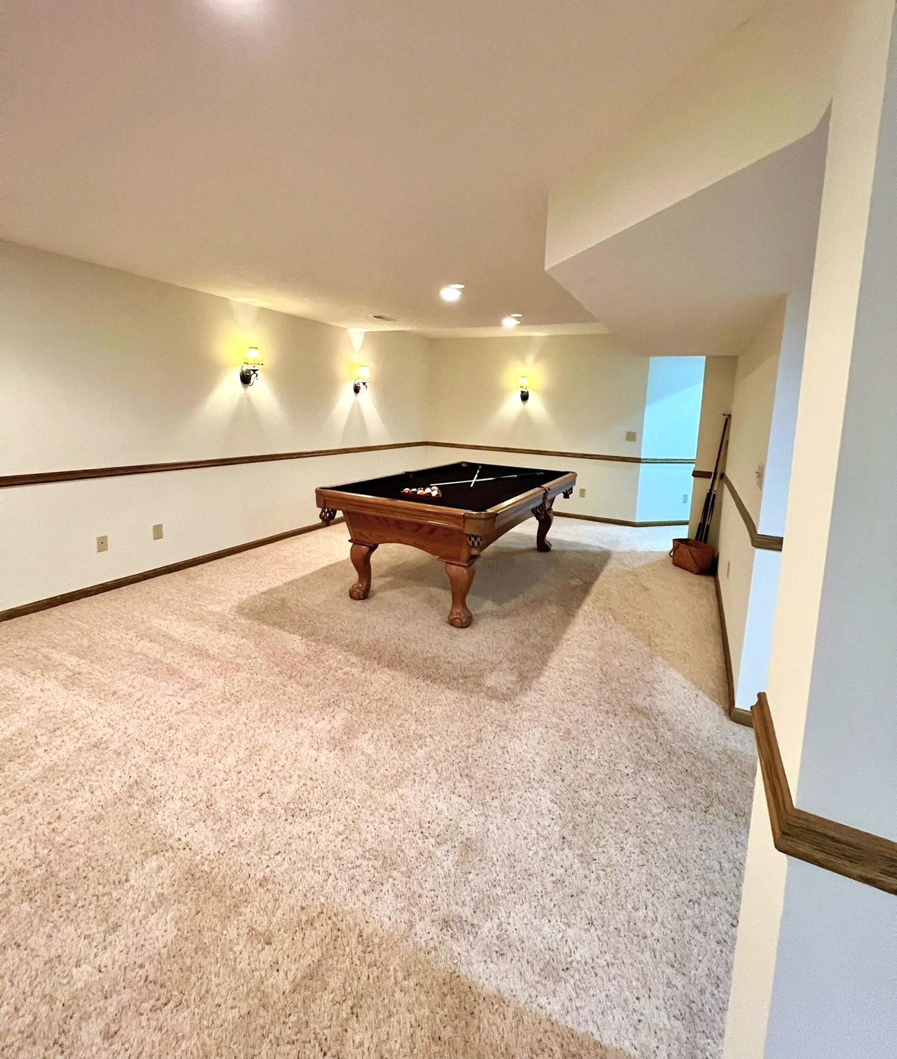 Another view of the expansive family room. The pool table can stay.