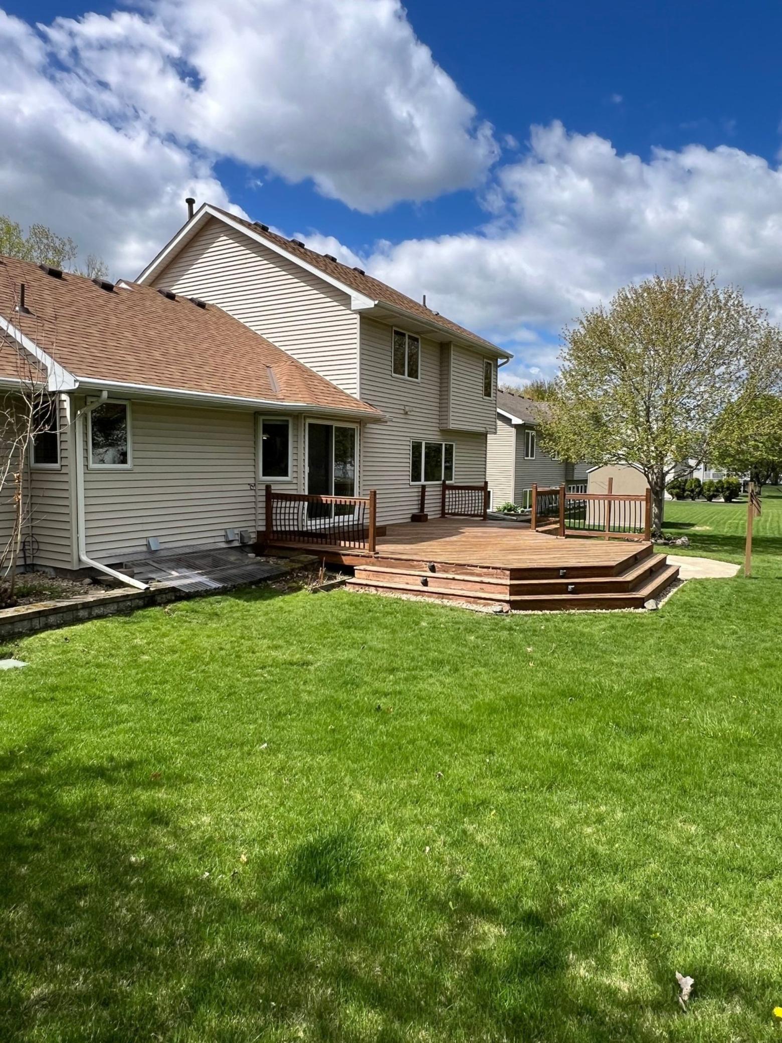 The backyard also includes in-ground sprinklers, drain tile, & a plexiglass egress window cover.