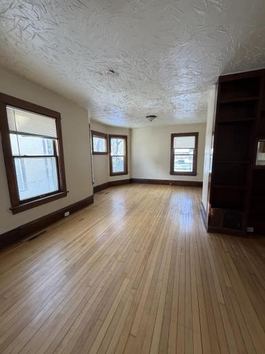The light-filled living area features a practical floor plan combining living room and dining area