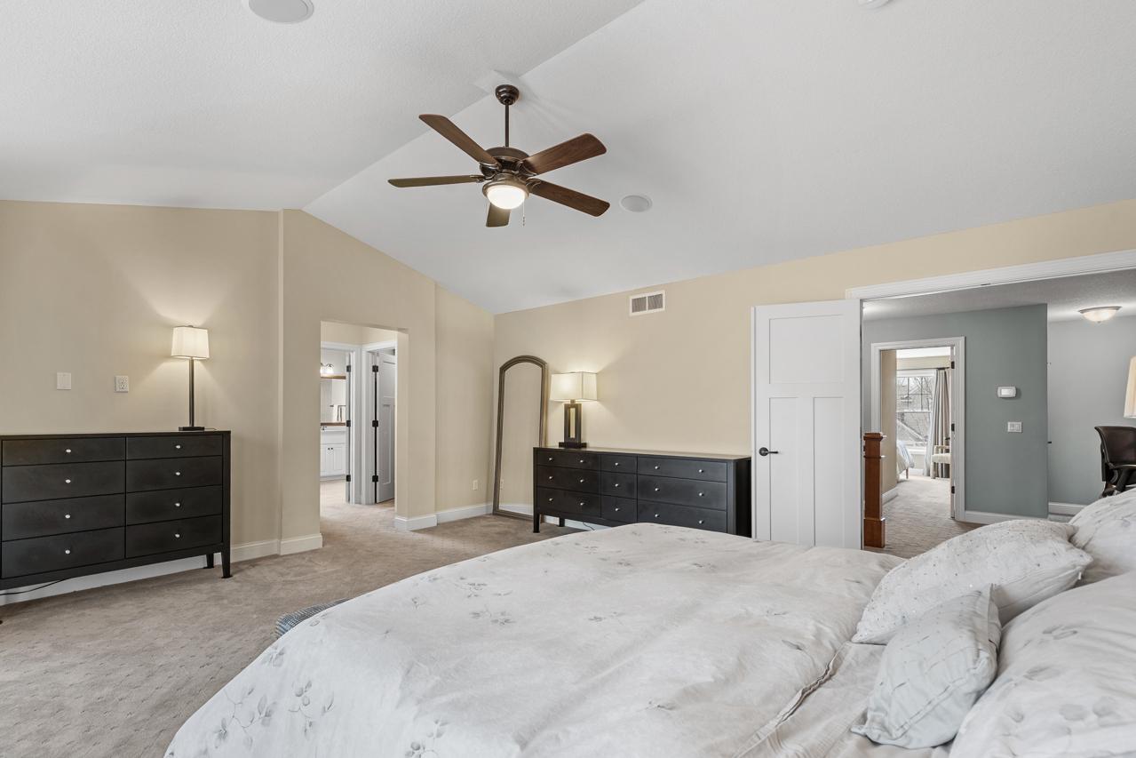 Two oversized walk-in closets with custom Closet Factory organization systems