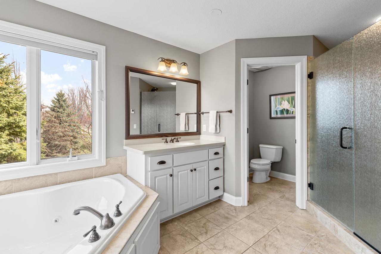 Relaxing jetted soaking tub and walk-in shower