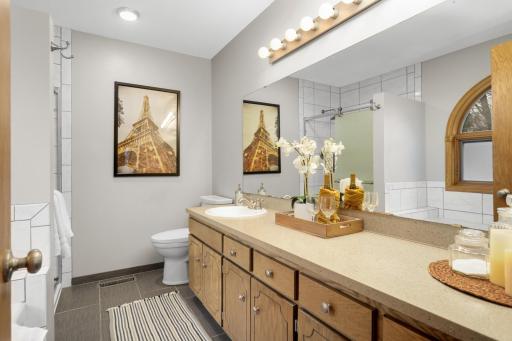 On-suite Primary (soaker tub + tile shower)