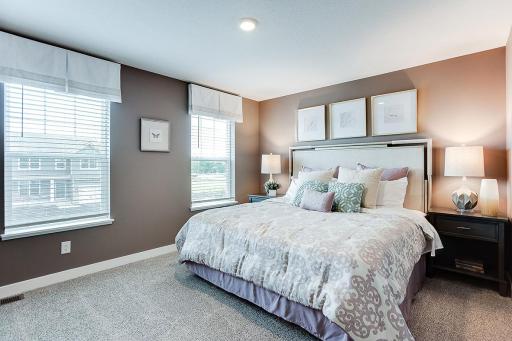The homes primary bedroom is an oasis of its own! Complete with a private bath and TWO walk-in closets, it's the perfect setting to start and end each day in! Picture of previously built model home, finishes, selections, and colors will vary.