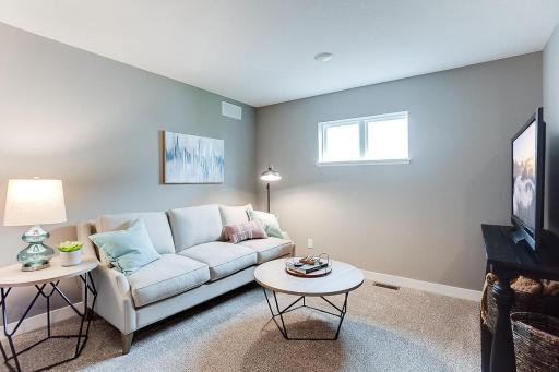 The home's loft area offers more than 100 square feet of additional living space and located just steps away from each of the home's four upper level bedrooms! Picture of previously built model home, finishes, selections, and colors will vary.