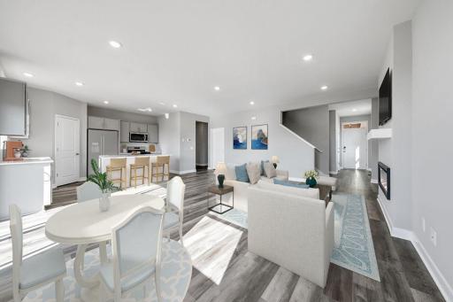 One of many highlights in the main level, the homes fireplace offers a touch of modernization of a space already loaded with a contemporary layout! Virtually staged photo.
