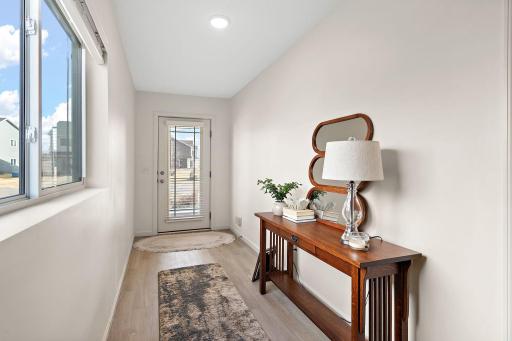 A bright and spacious entry way keeps clutter out of the living areas.