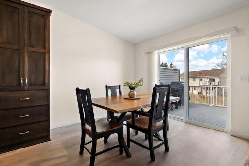 The dining area has a patio door to access the maintenance free deck.