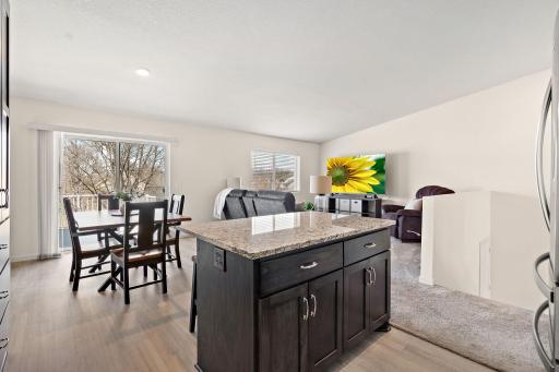 Upstairs is an open concept living area with views of the backyard.