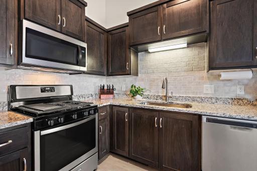 The kitchen has a timeless tile backsplash and many other upgrades!