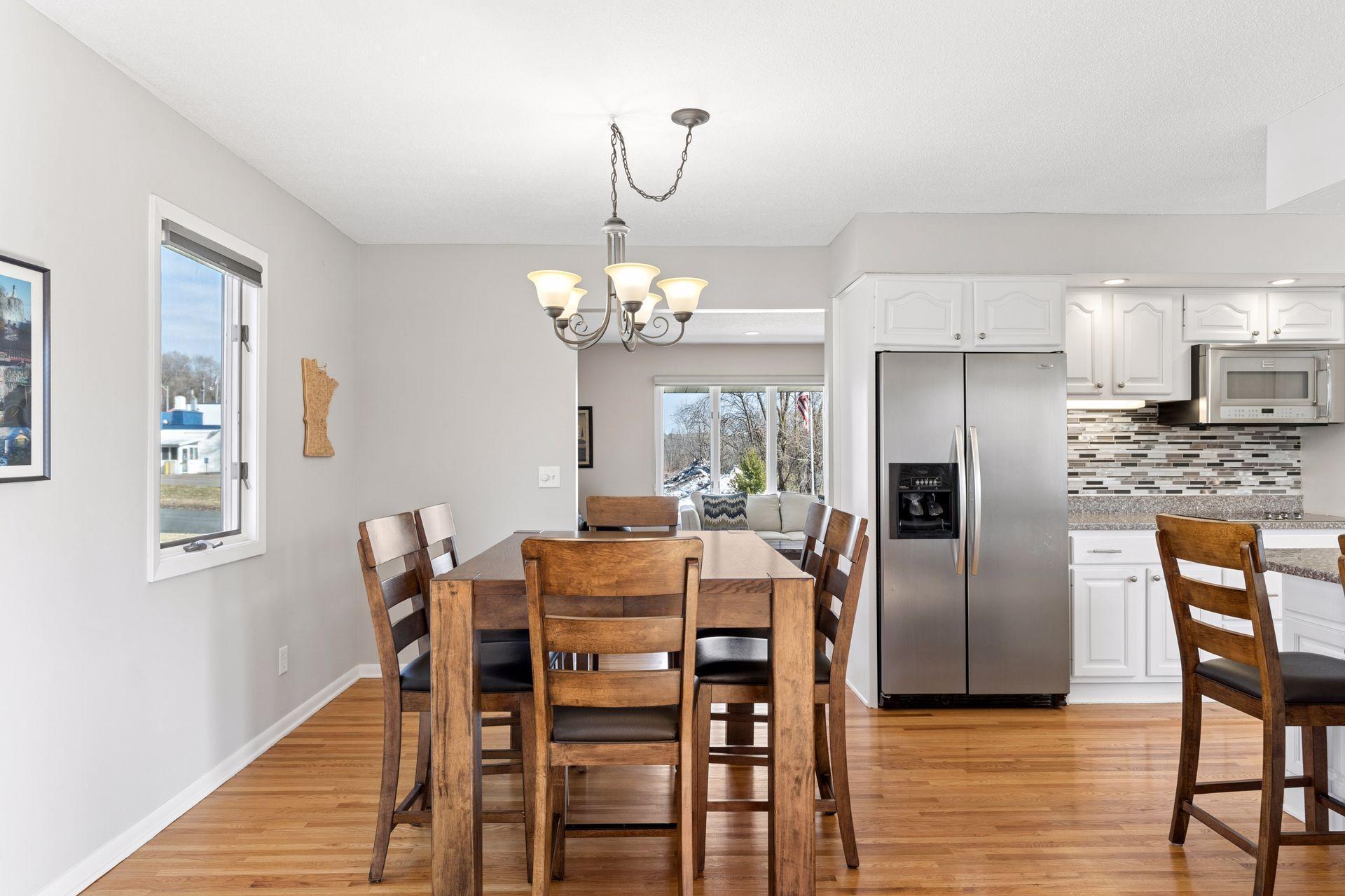 Shared kitchen/dining also with hardwood floors.