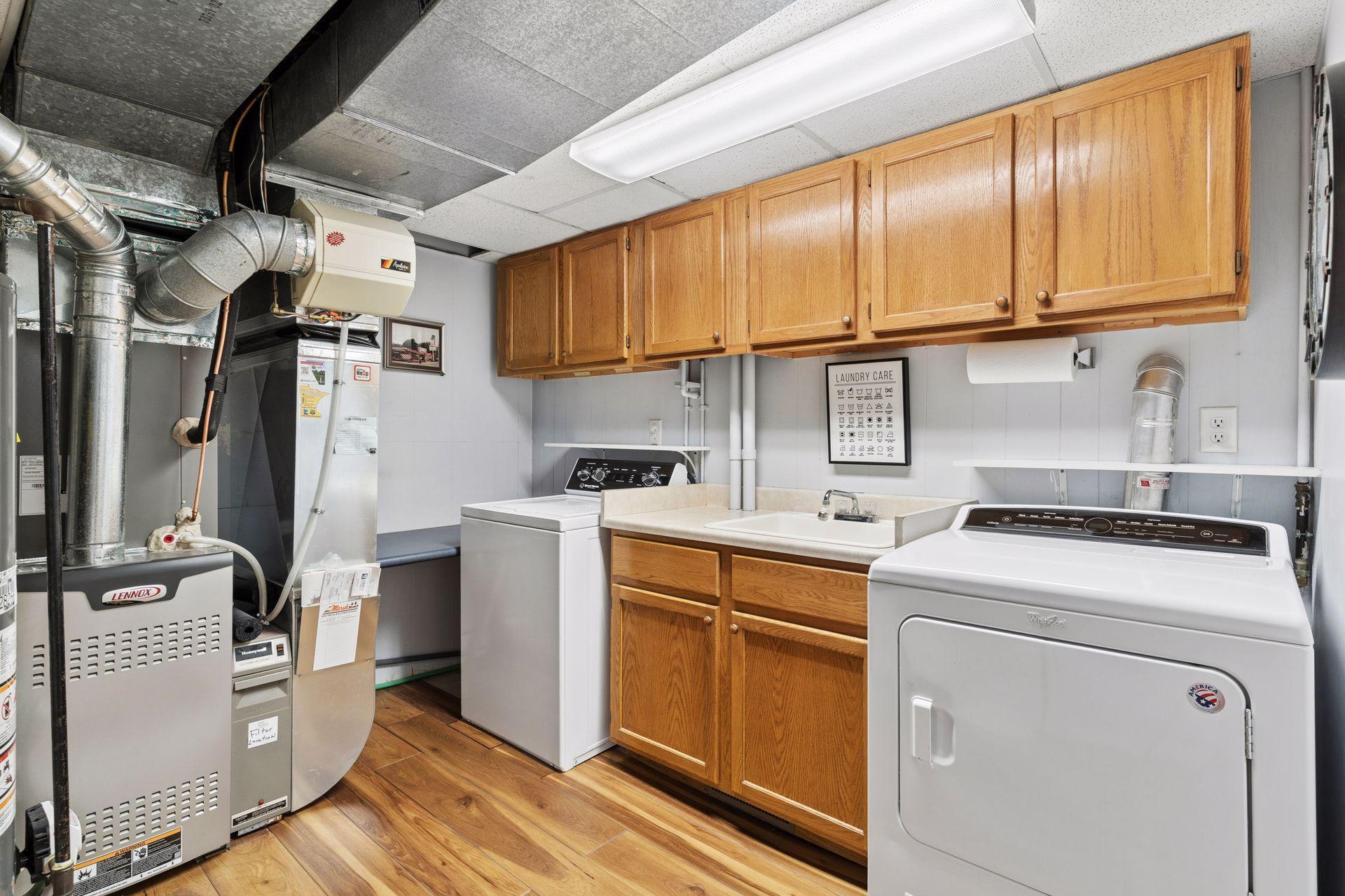 Laundry room with 2024 Speed Queen washer.