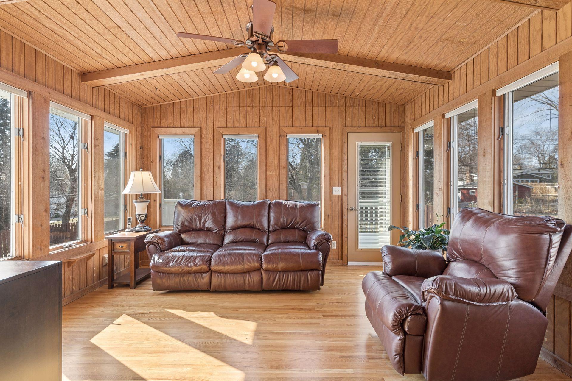 Warm and welcoming rear 4 season porch. Cedar T&G walls and ceiling, fabulous scenic views of the treetops!