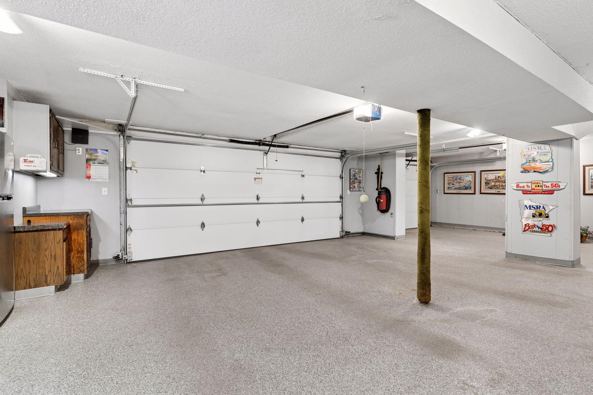 Insulated and heated with expo floors, a sink, cabinets and counters, plus a walkout to the backyard.