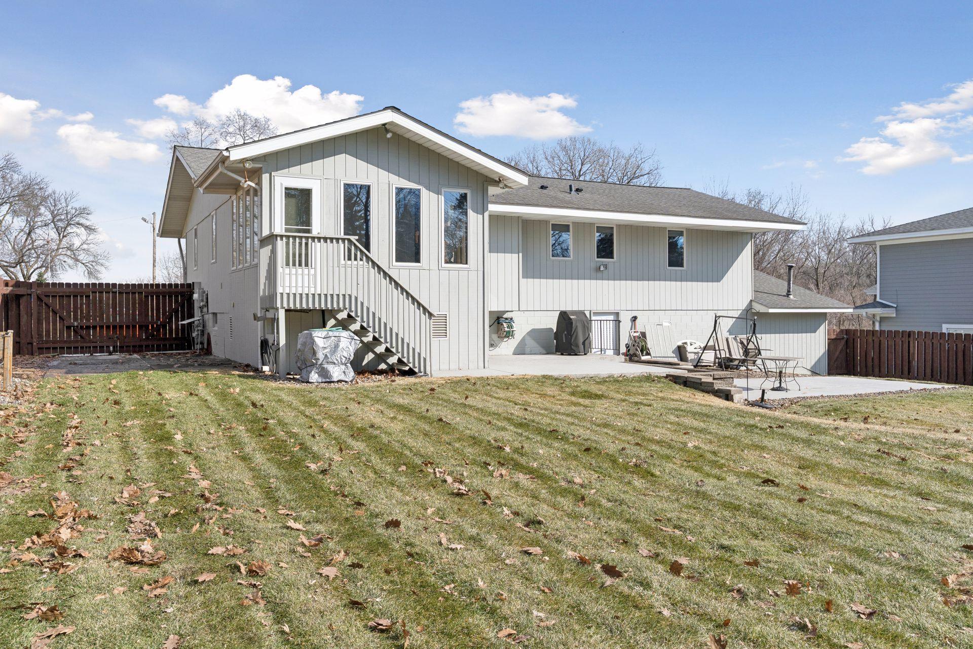 Two concrete patios provide entertaining space - easy gathering with the Weber built-in natural gas grill.