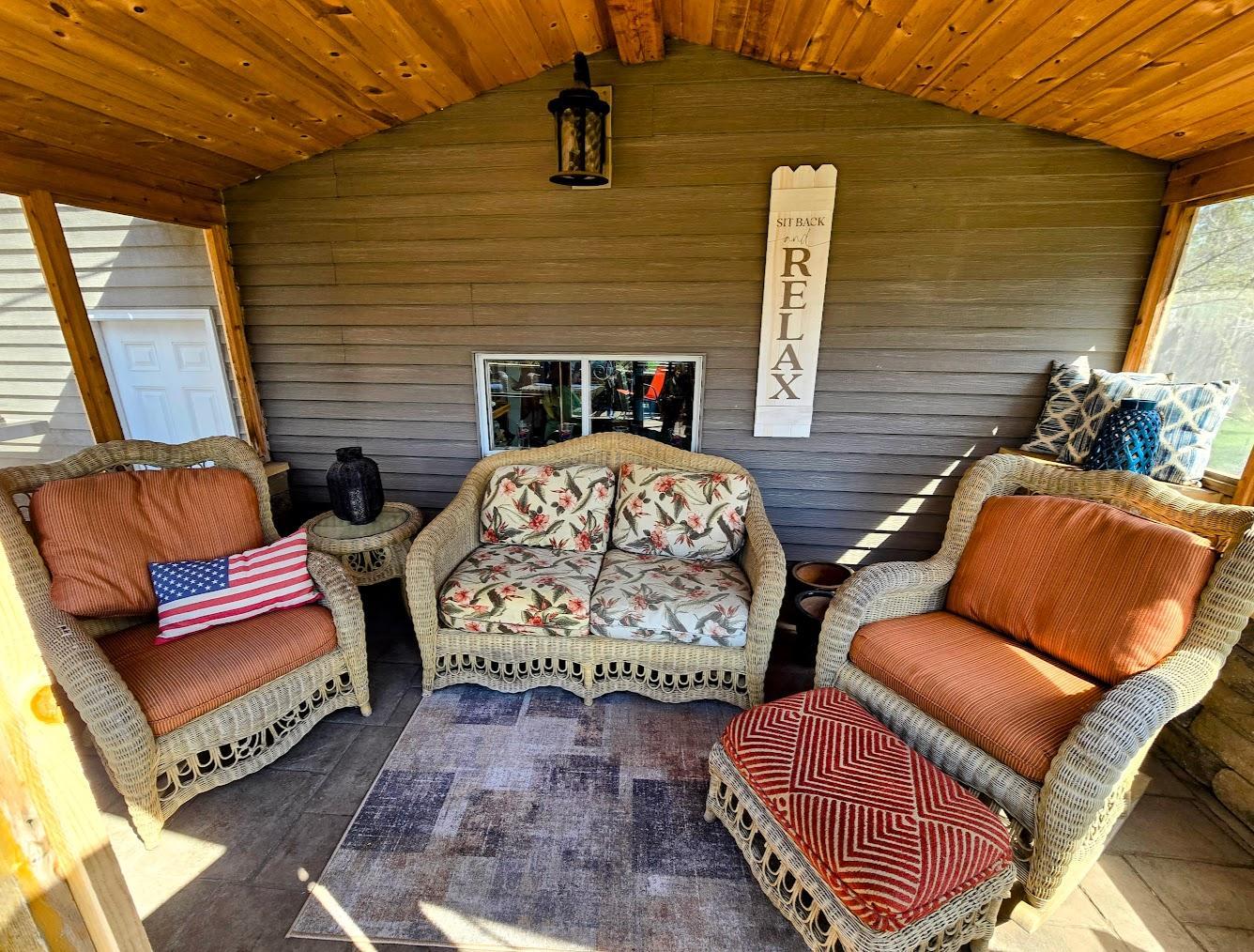 Interior of screened porch- relax inside the screened in porch to take a break from the sun.