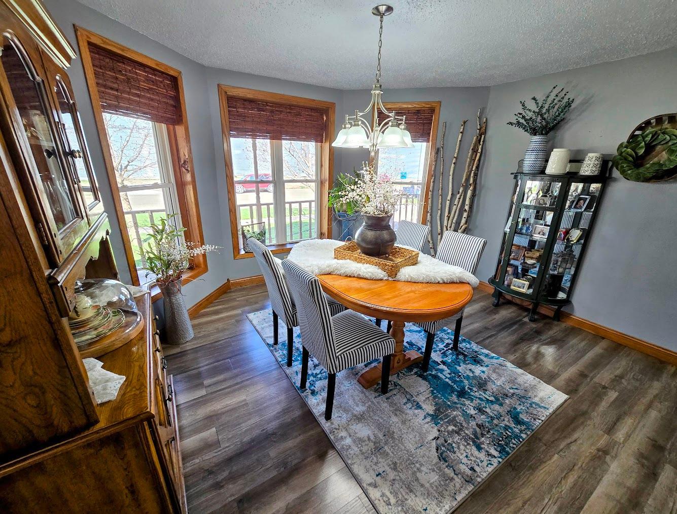 Formal dining room with bow windows