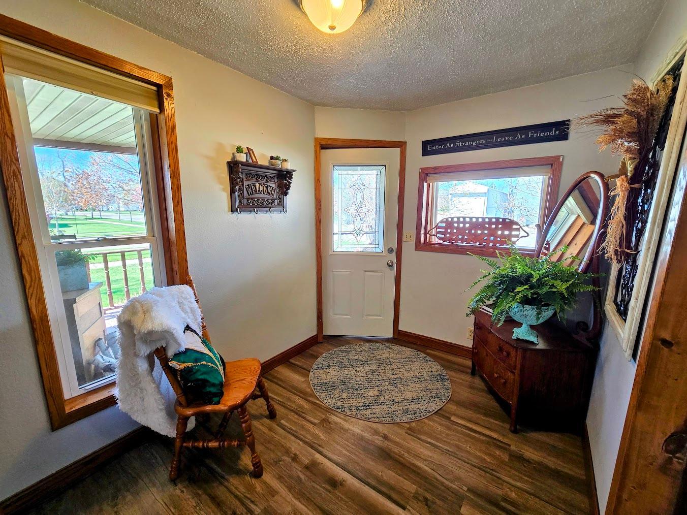 Step inside the front foyer-admire the spacious living room with bow windows
