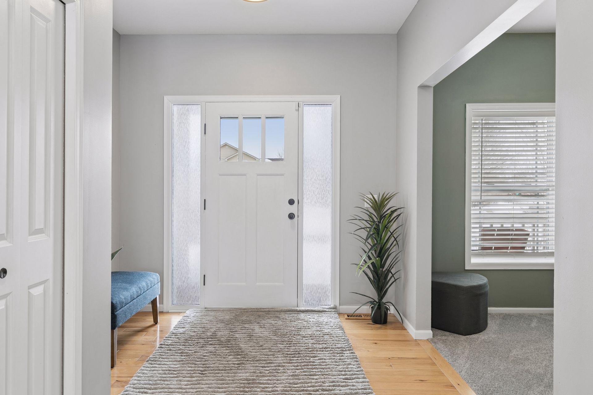Bright and inviting front entry with two sidelight windows