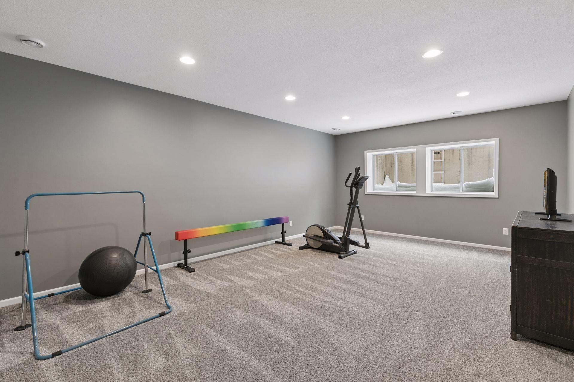 basement family room with high ceilings