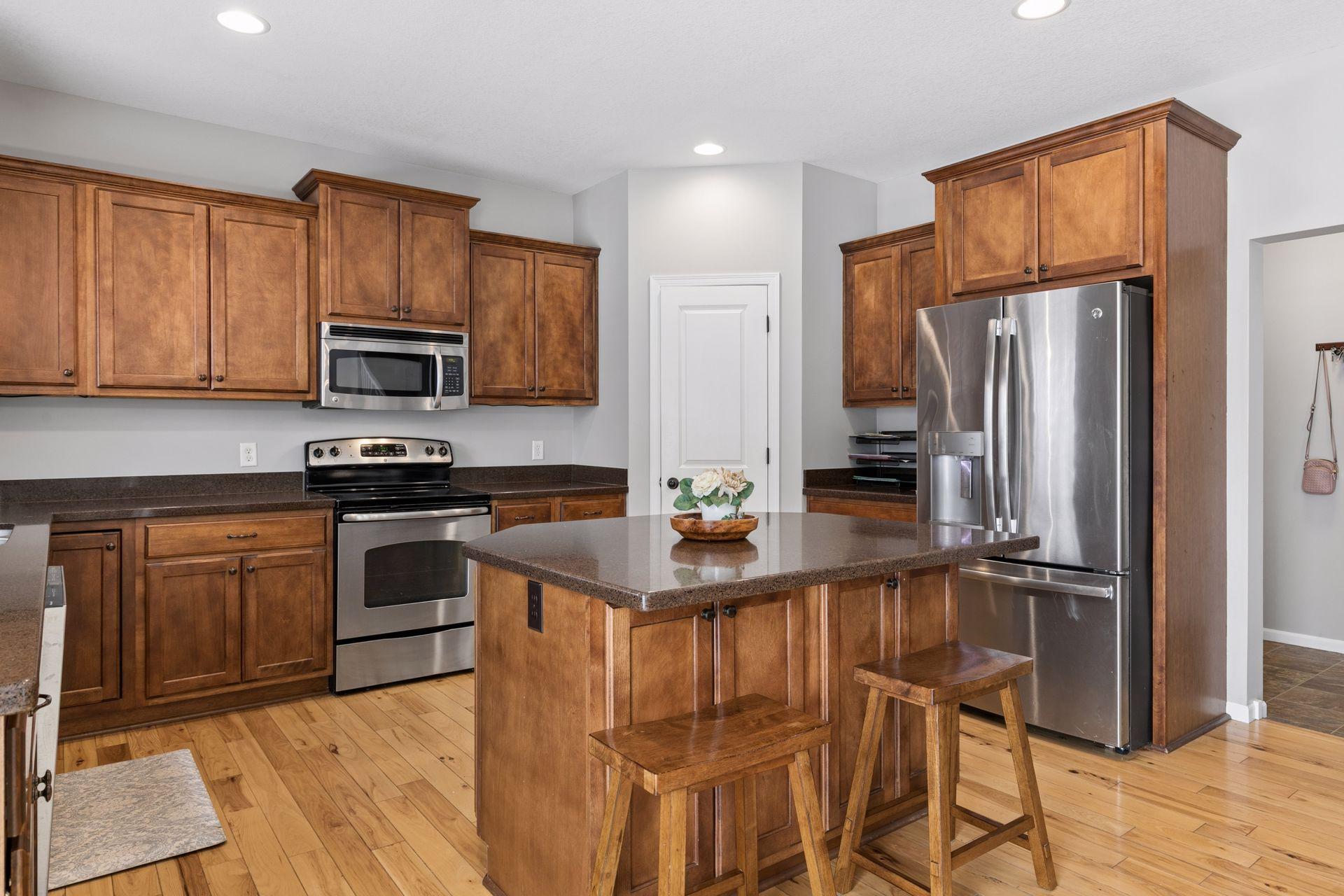 kitchen has a large corner walk in pantry
