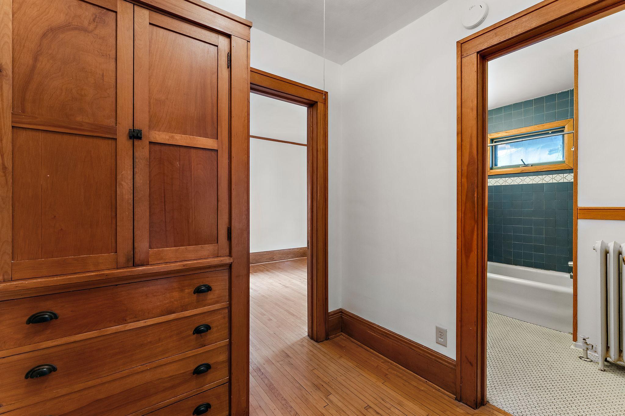 Upper unit hallway to bath and bedroom