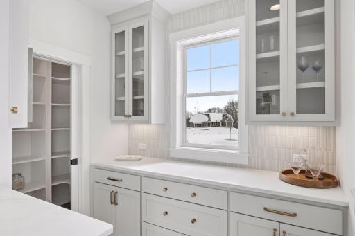 Bulter's pantry with plenty of cabinet space off the kitchen