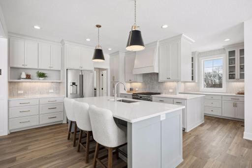 Clean, crisp to the ceiling white cabinets