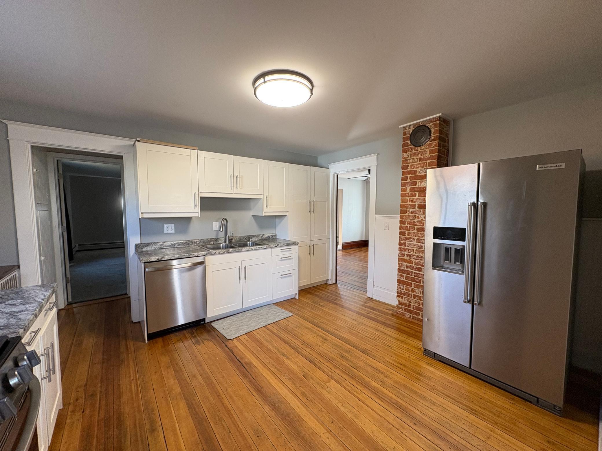 kitchen with exposed brick chimney